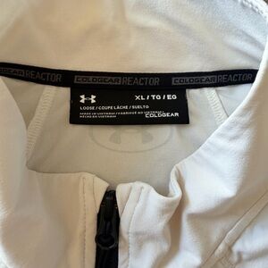 Size XL Under Armour Lightweight Jacket with front left chest and side pocket.